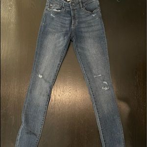 Blue skinny jeans with fringes on the bottom